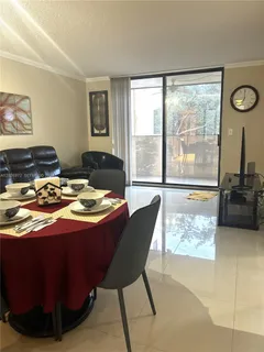 a bedroom with a bed and glass window