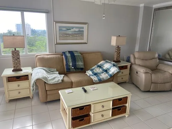 a living room with furniture and a window