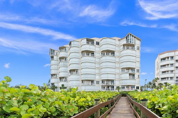 a view of a building with a flower garden