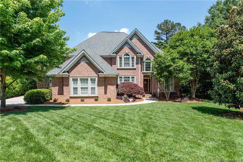 904 Ashford Way, Unit 2 Fort Mill, SC 29708 - Photo 1 of 24 a front view of a house with a yard