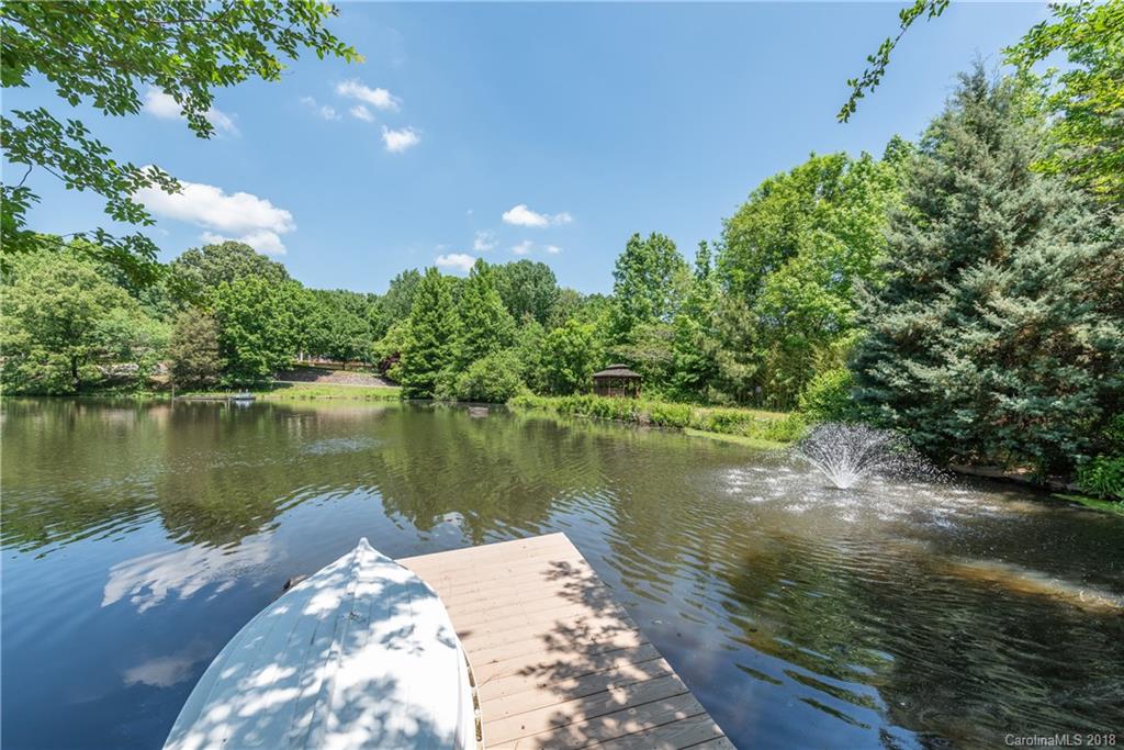 904 Ashford Way, Unit 2 Fort Mill, SC 29708 - Photo 2 of 24 a view of a lake with a large trees