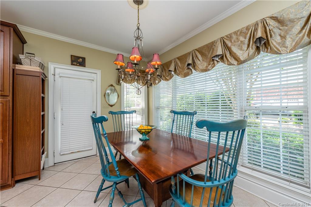 904 Ashford Way, Unit 2 Fort Mill, SC 29708 - Photo 11 of 24 a view of a dining room with furniture window and wooden floor