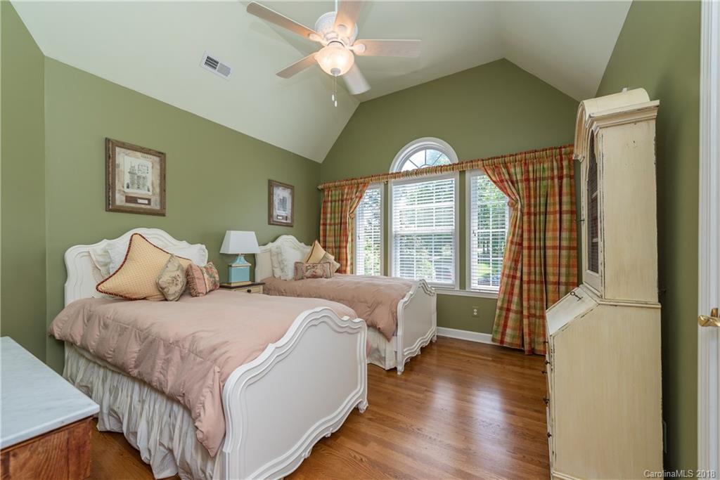 904 Ashford Way, Unit 2 Fort Mill, SC 29708 - Photo 15 of 24 a spacious bedroom with two beds and a large window
