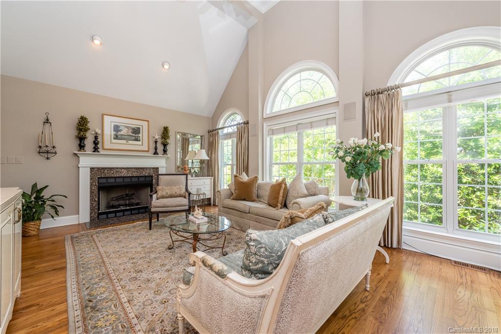 904 Ashford Way, Unit 2 Fort Mill, SC 29708 - Photo 4 of 24 a living room with furniture a large window and a fireplace