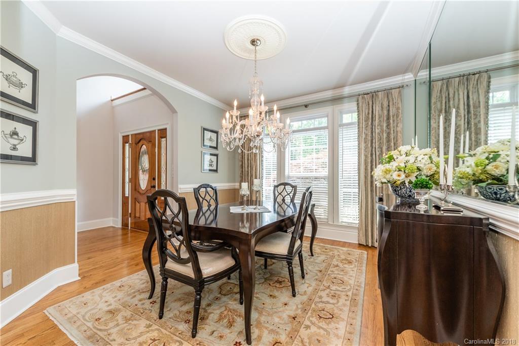 904 Ashford Way, Unit 2 Fort Mill, SC 29708 - Photo 7 of 24 a dining room with furniture a chandelier and wooden floor