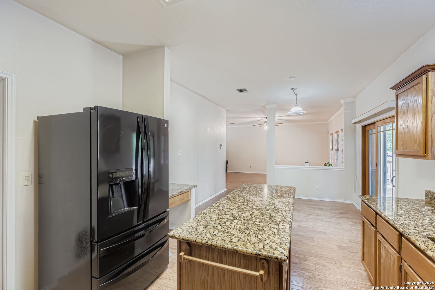5803 Spring Pebble San Antonio, TX 78247 - Photo 12 of 27 a kitchen with stainless steel appliances granite countertop a refrigerator and a sink