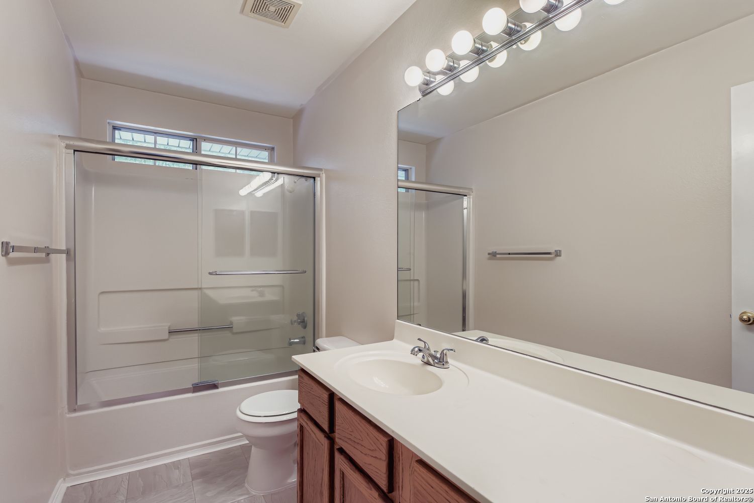 5803 Spring Pebble San Antonio, TX 78247 - Photo 20 of 27 a bathroom with a sink a toilet and shower