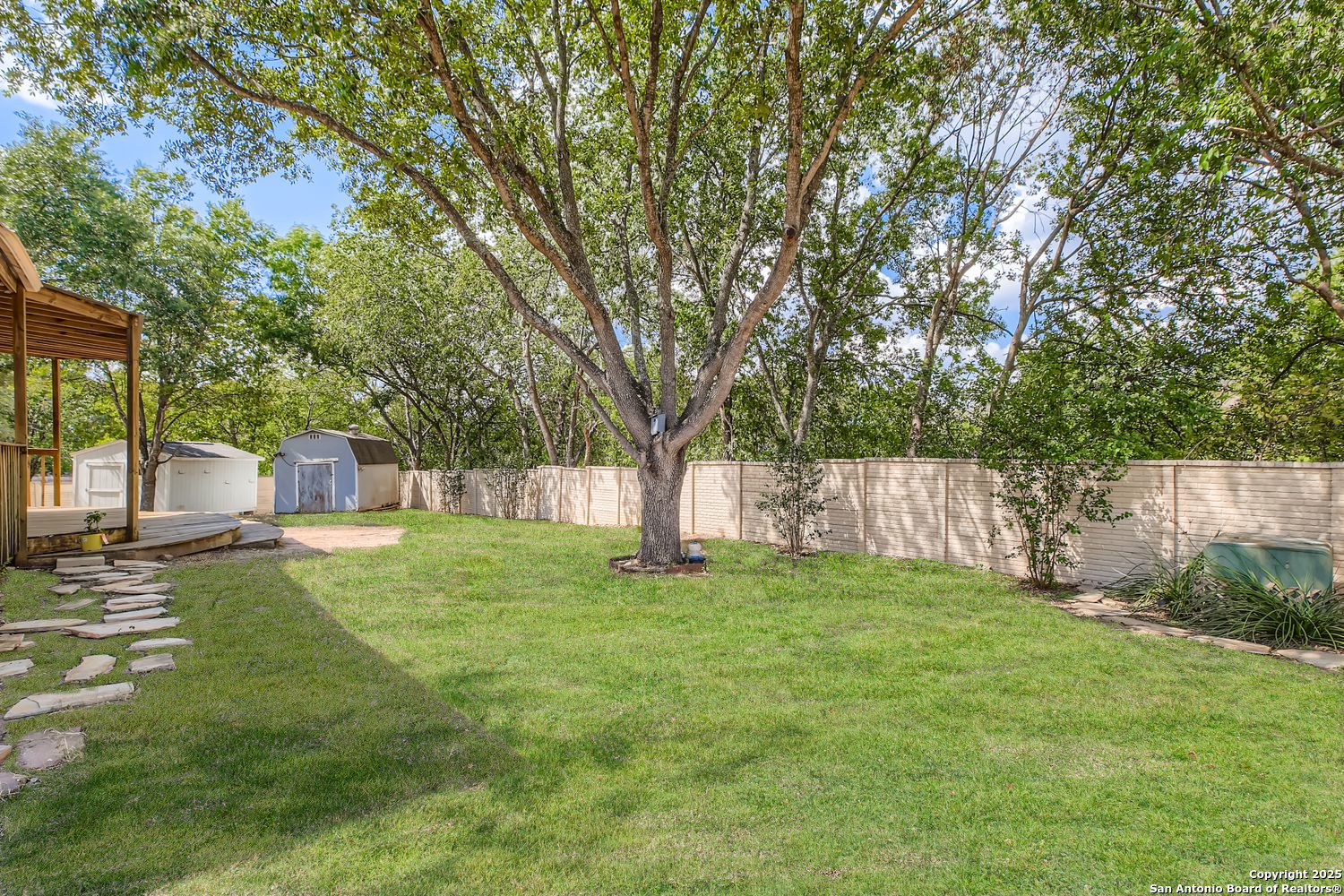 5803 Spring Pebble San Antonio, TX 78247 - Photo 24 of 27 a view of a backyard with a small cabin