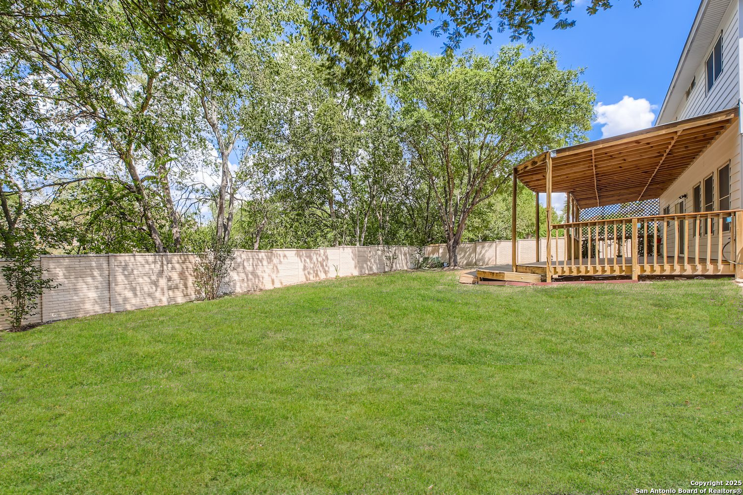 5803 Spring Pebble San Antonio, TX 78247 - Photo 27 of 27 a view of green field with a tree