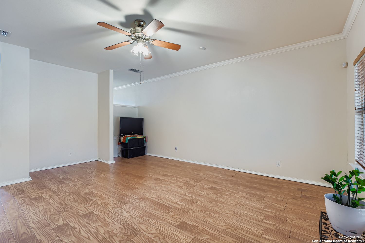 5803 Spring Pebble San Antonio, TX 78247 - Photo 5 of 27 a view of an empty room with wooden floor