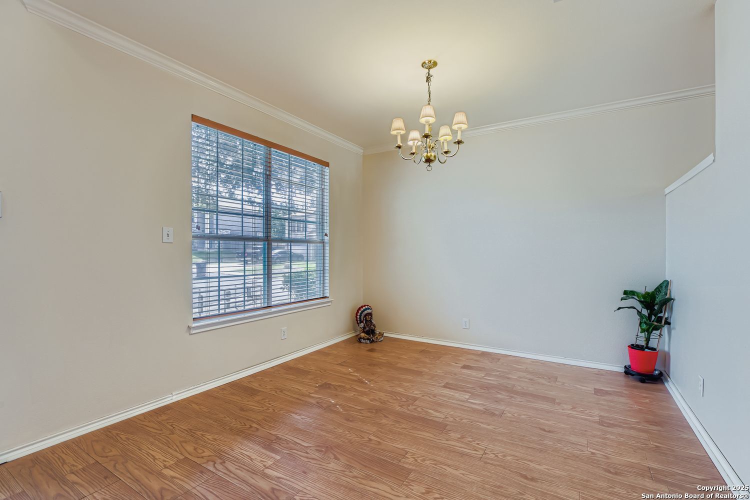5803 Spring Pebble San Antonio, TX 78247 - Photo 8 of 27 a view of empty room with wooden floor and fan