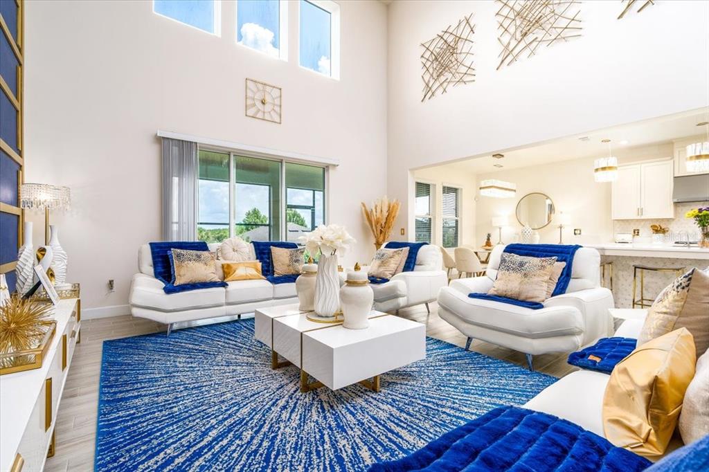 1296 Waterview Ridge Circle Apopka, FL 32703 - Photo 21 of 60 a living room with furniture and a large window