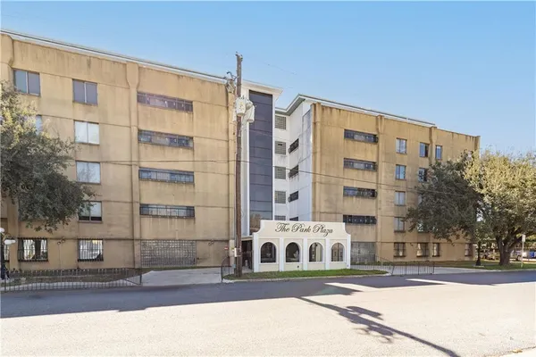 a building exterior view with tall buildings