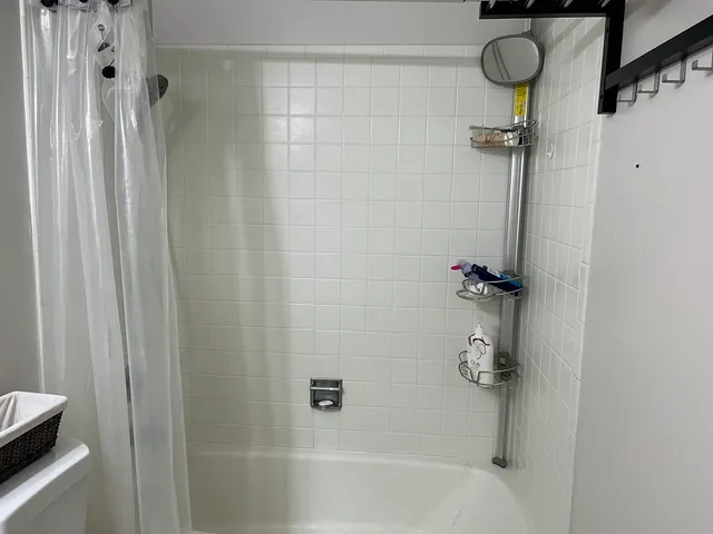 a bath room with a shower