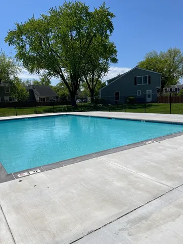 a view of swimming pool with an outdoor space and seating area