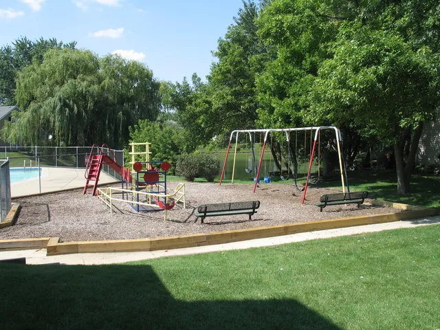 a view of a park with swings