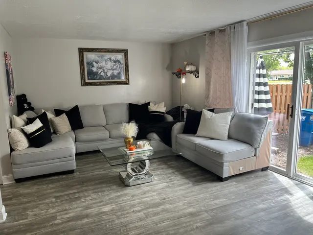 a living room with furniture and a large window