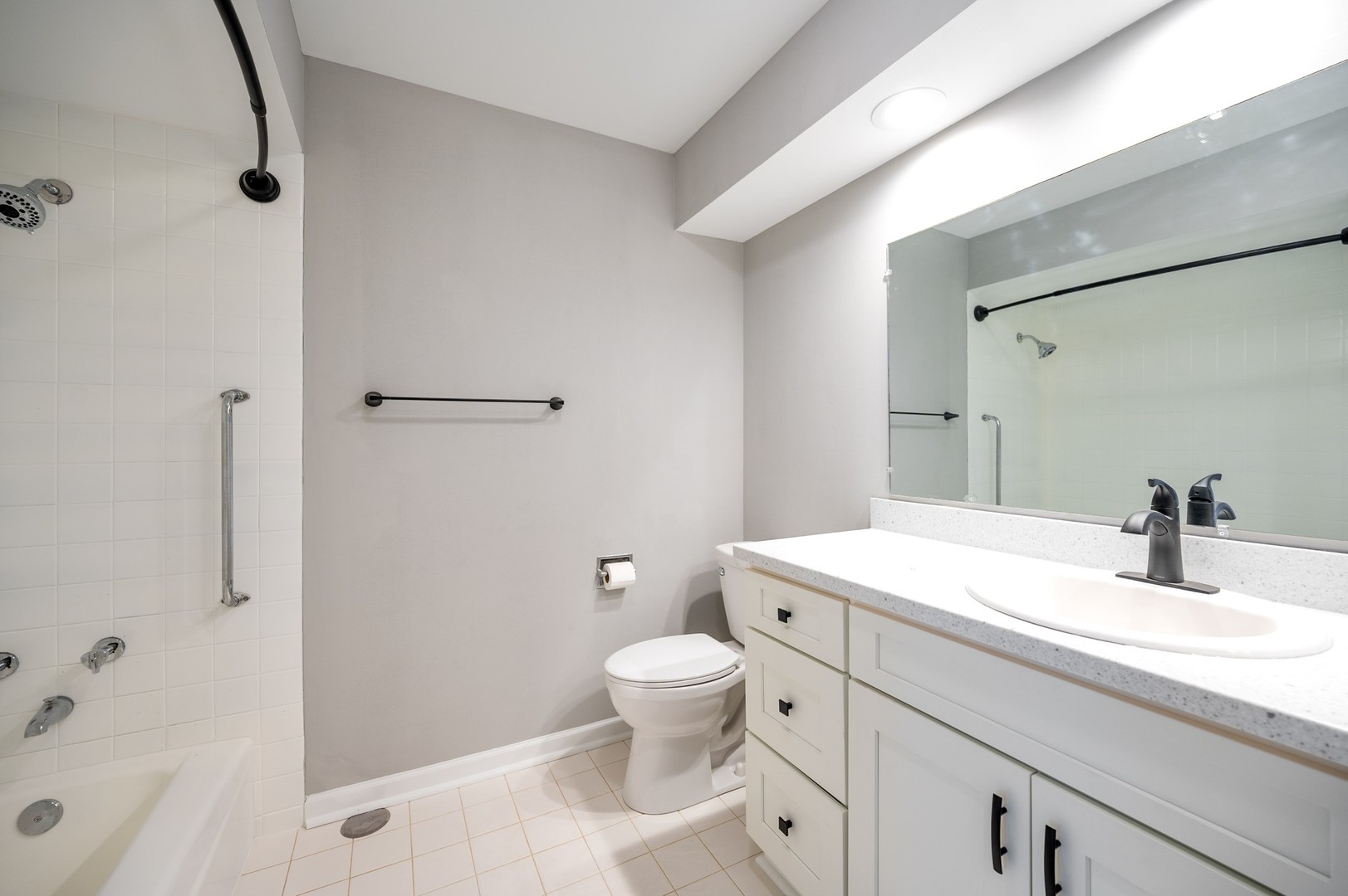 1982 Cherry Lane, Unit 15B Northbrook, IL 60062 - Photo 11 of 11 a bathroom with a sink a toilet and shower