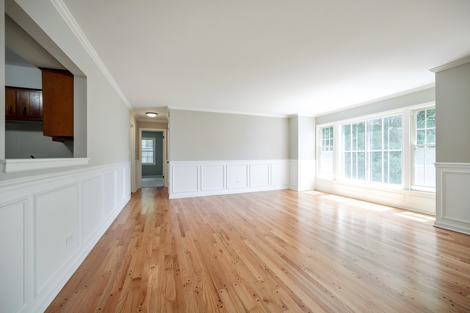 1982 Cherry Lane, Unit 15B Northbrook, IL 60062 - Photo 5 of 11 wooden floor in an empty room with a window