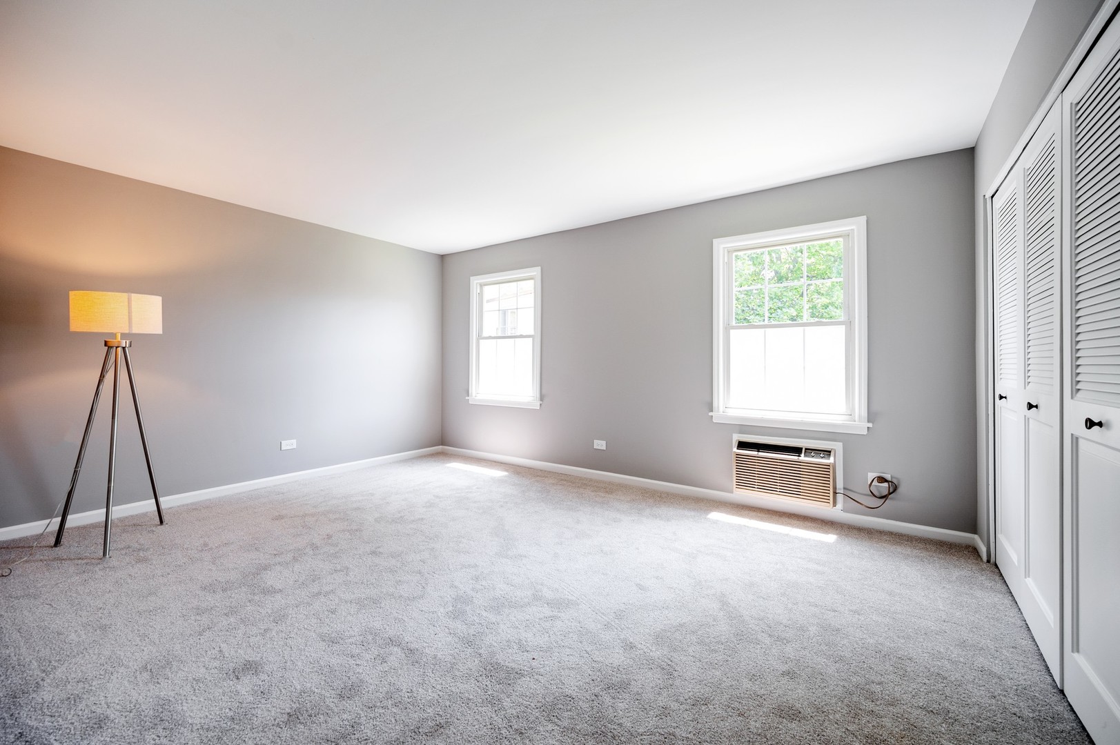 1982 Cherry Lane, Unit 15B Northbrook, IL 60062 - Photo 9 of 11 a view of an empty room with a window