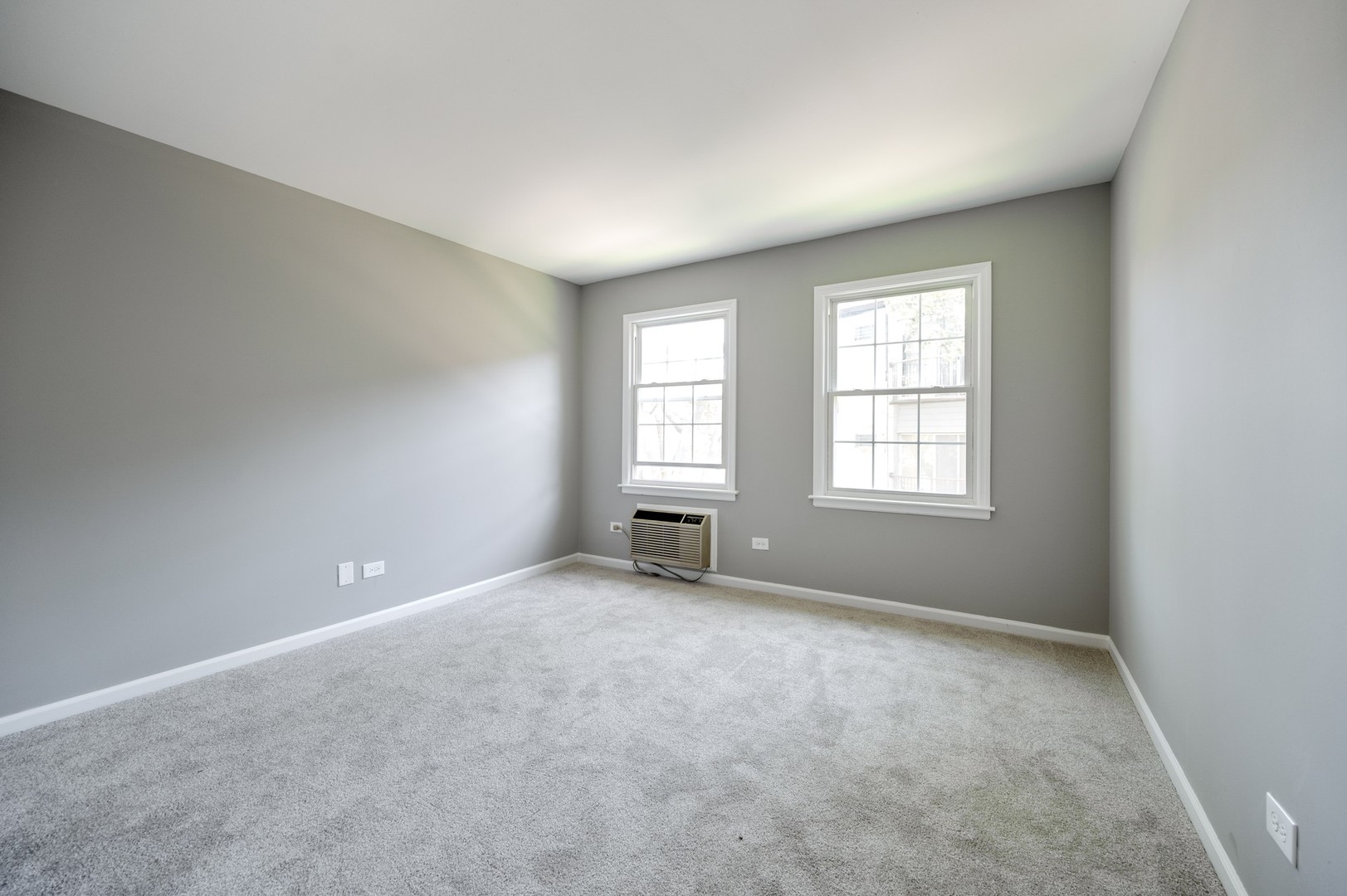 1982 Cherry Lane, Unit 15B Northbrook, IL 60062 - Photo 10 of 11 an empty room with windows