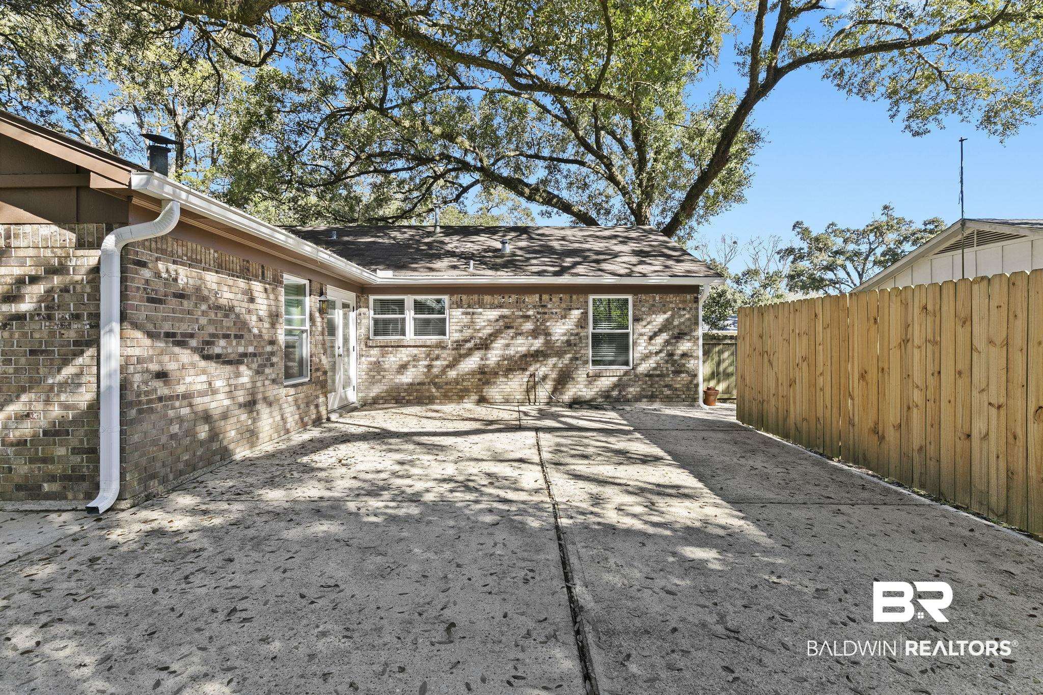 5817 Woodgate Road Mobile, AL 36609 - Photo 66 of 85 View of patio / terrace featuring fence