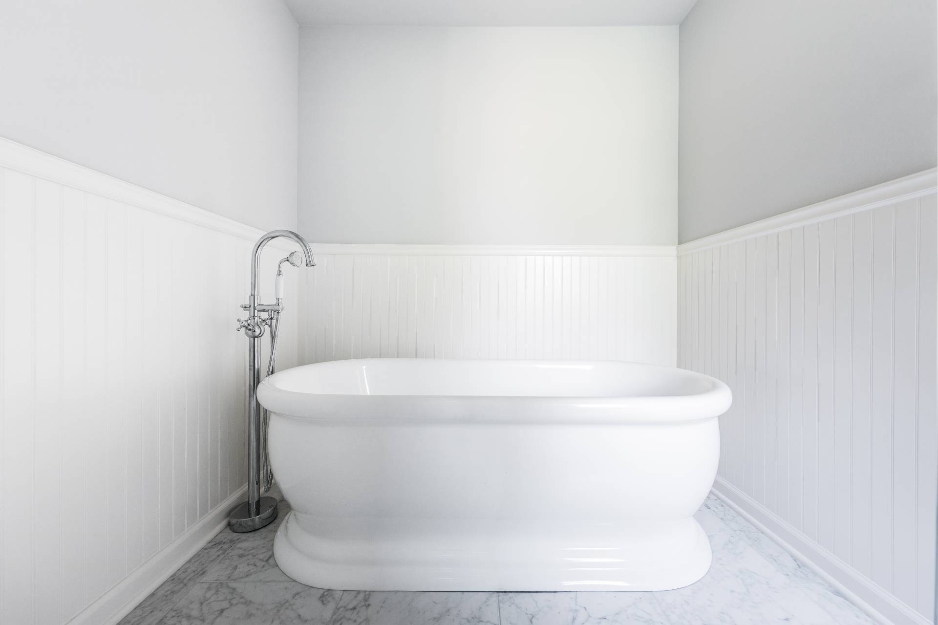 27 Ocean Parkway East Hampton, NY 11937 - Photo 11 of 21 a white bath tub sitting in a bathroom