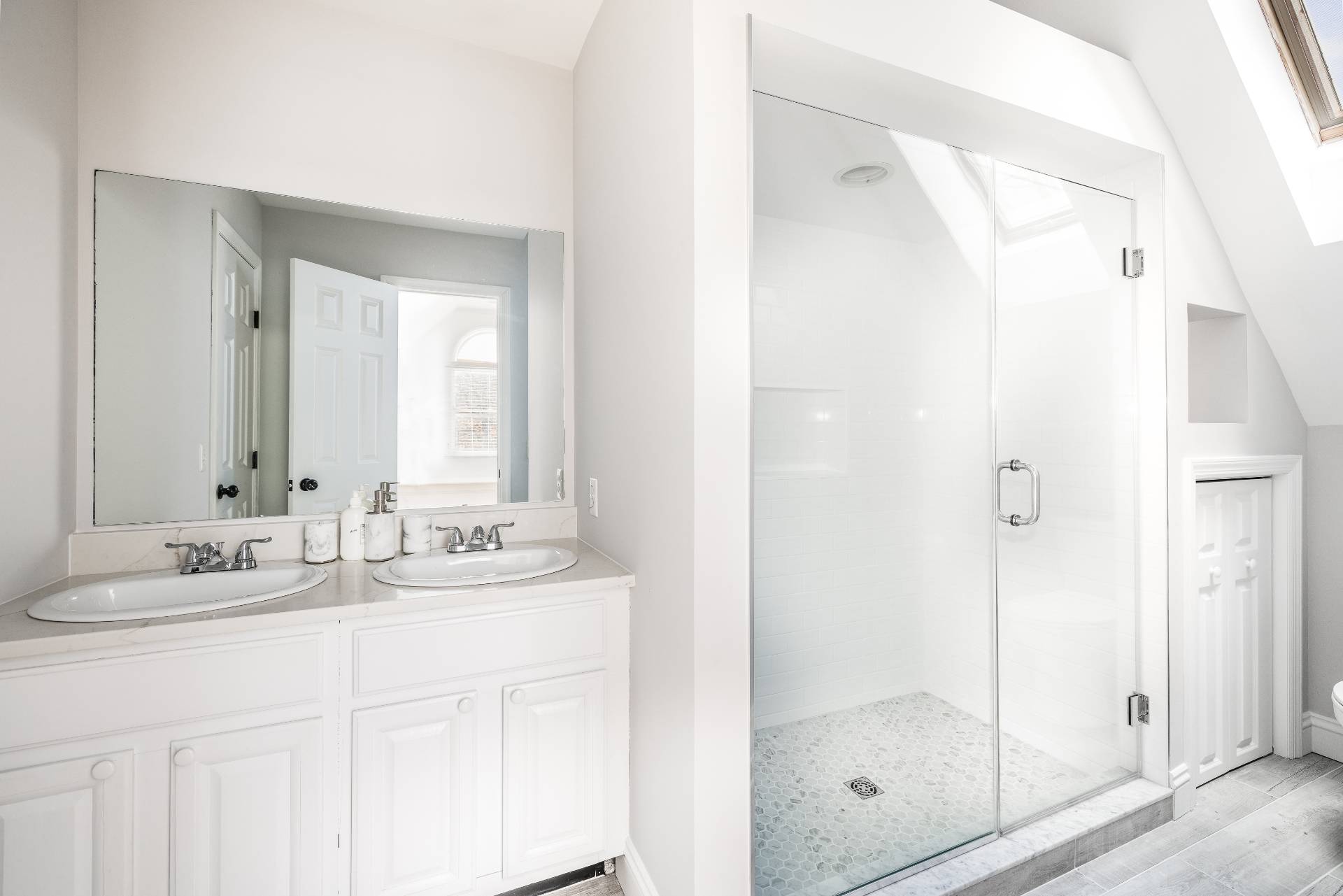 27 Ocean Parkway East Hampton, NY 11937 - Photo 13 of 21 a bathroom with a shower sink and mirror