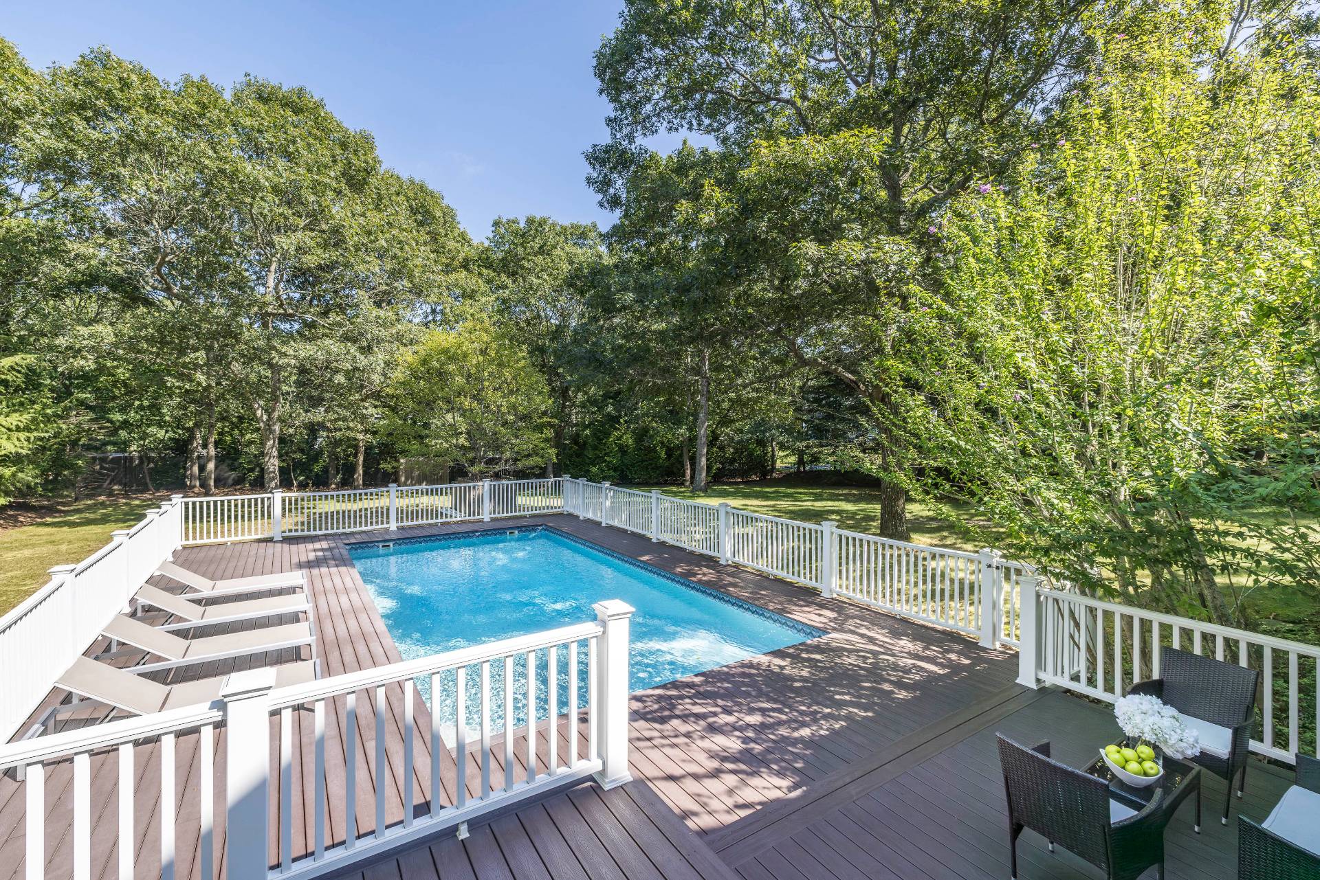 27 Ocean Parkway East Hampton, NY 11937 - Photo 18 of 21 a view of a swimming pool with a patio and yard