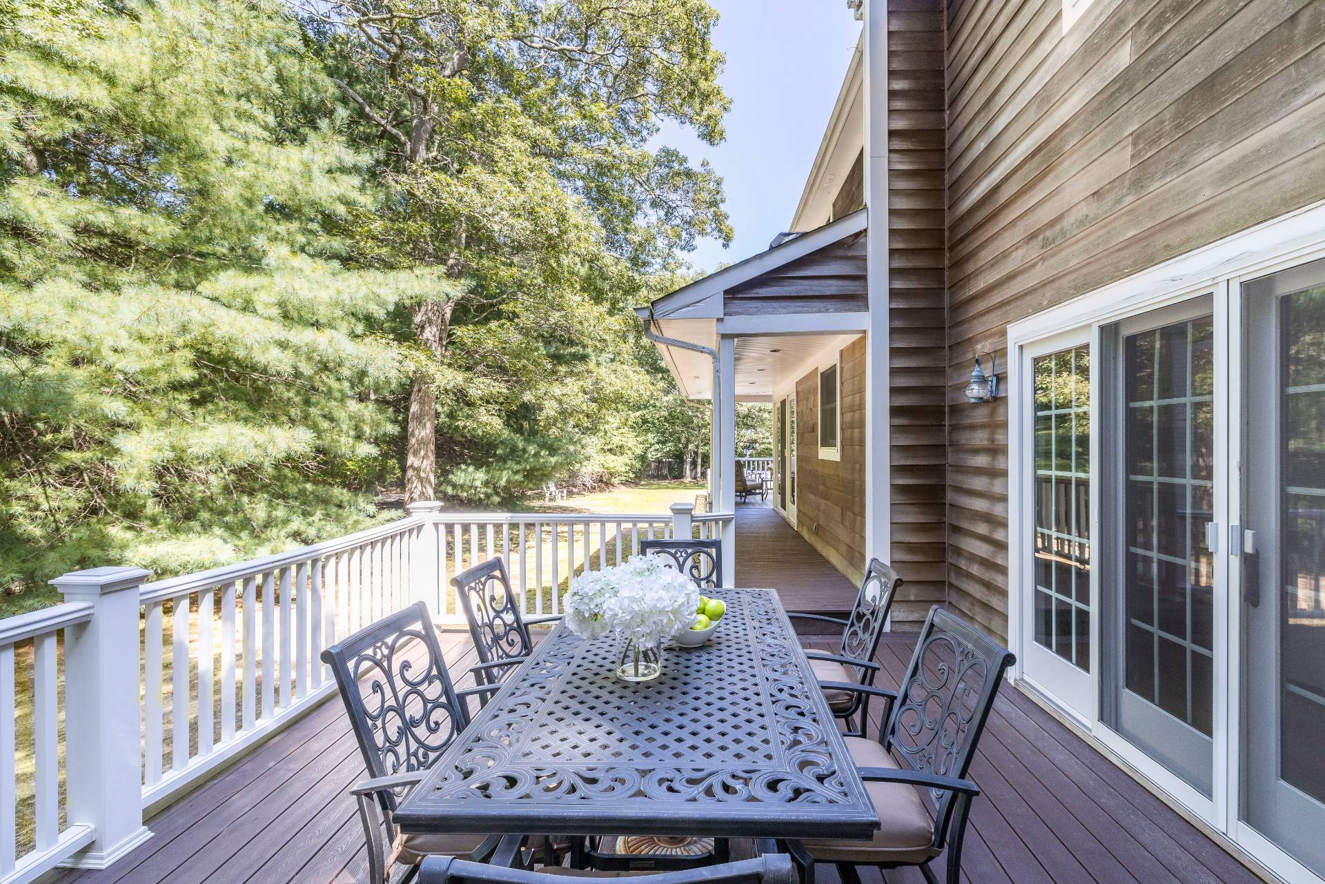 27 Ocean Parkway East Hampton, NY 11937 - Photo 21 of 21 a view of balcony with furniture and wooden deck