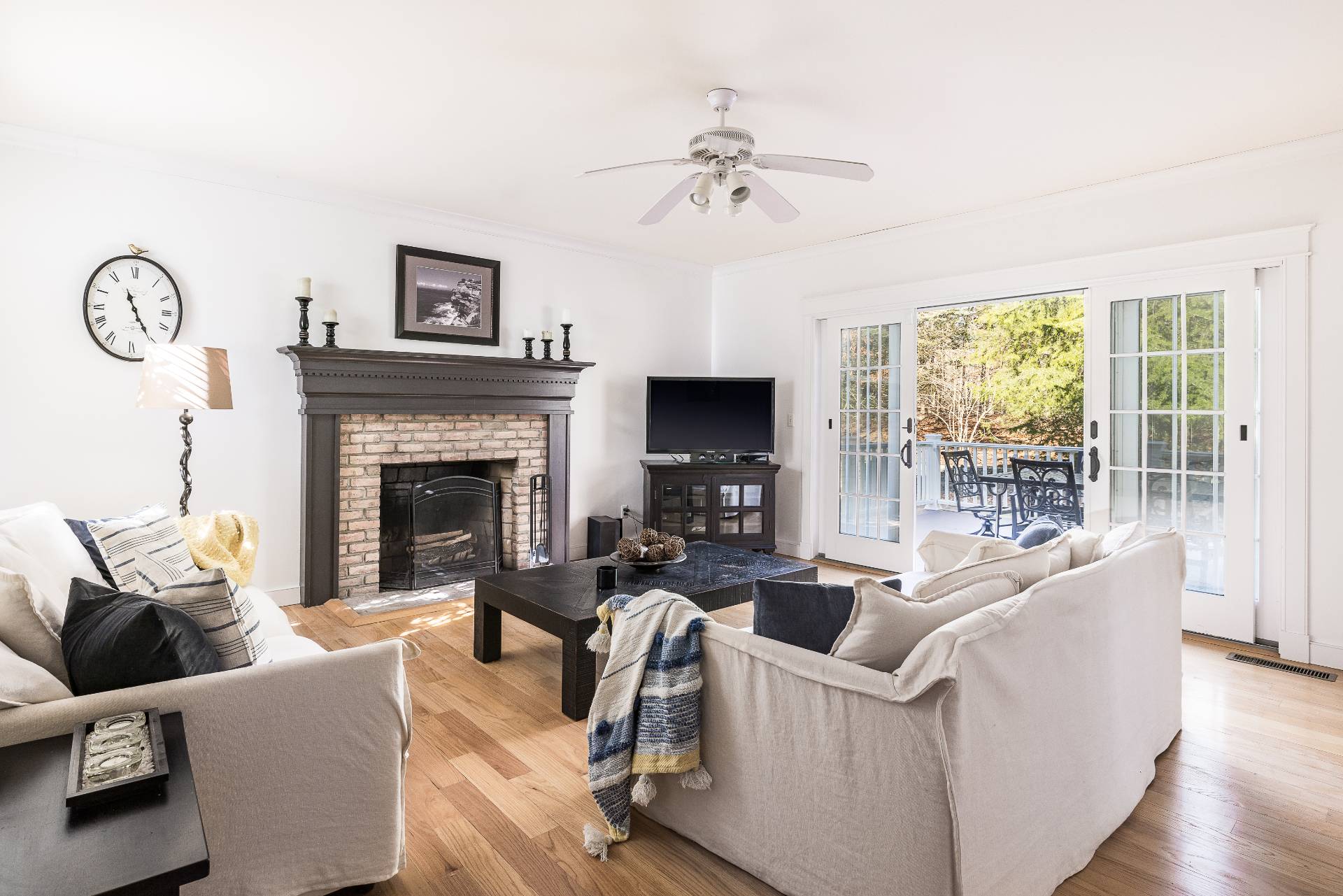 27 Ocean Parkway East Hampton, NY 11937 - Photo 3 of 21 a living room with furniture and a fireplace