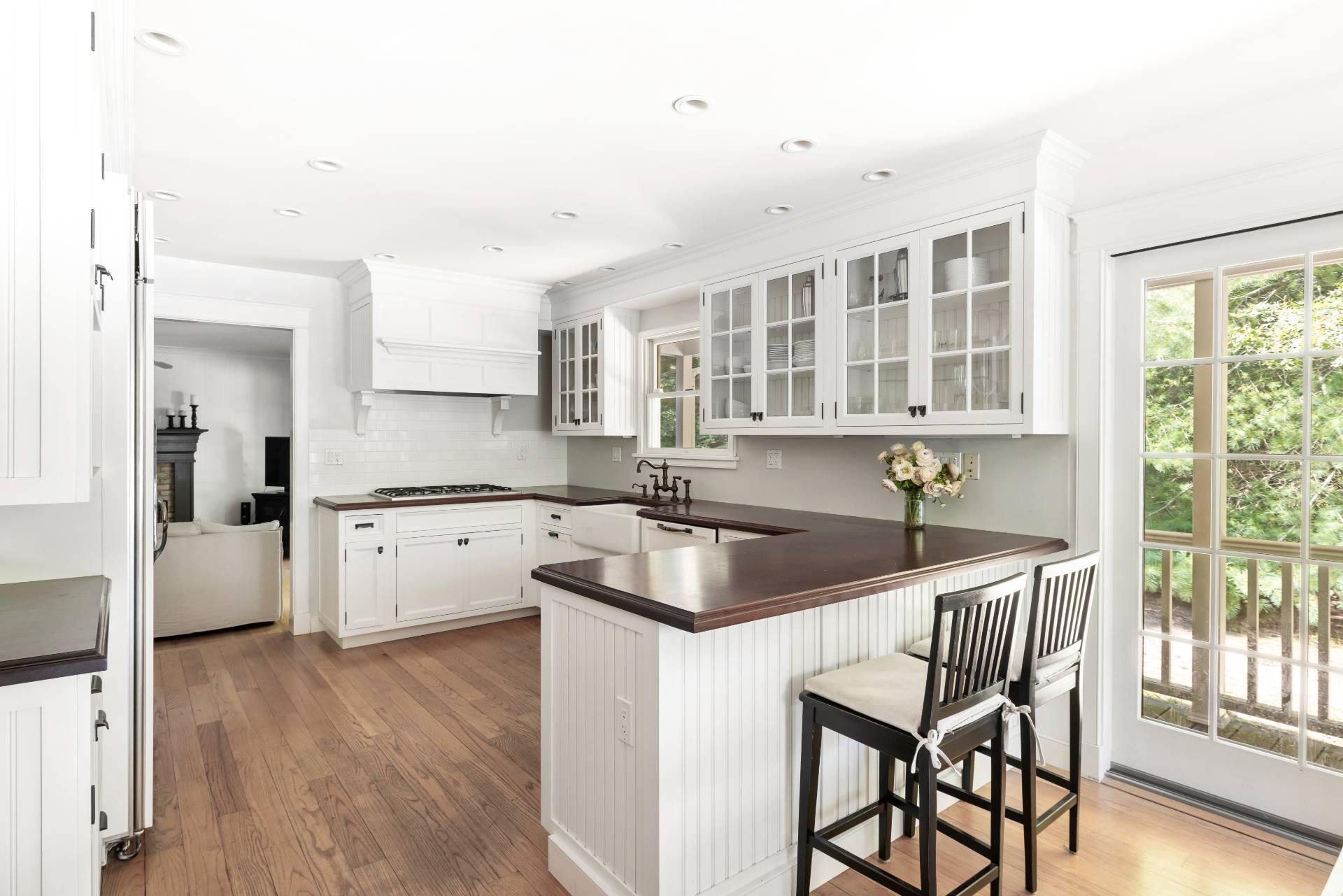 27 Ocean Parkway East Hampton, NY 11937 - Photo 5 of 21 a kitchen that has a sink a table and chairs in it