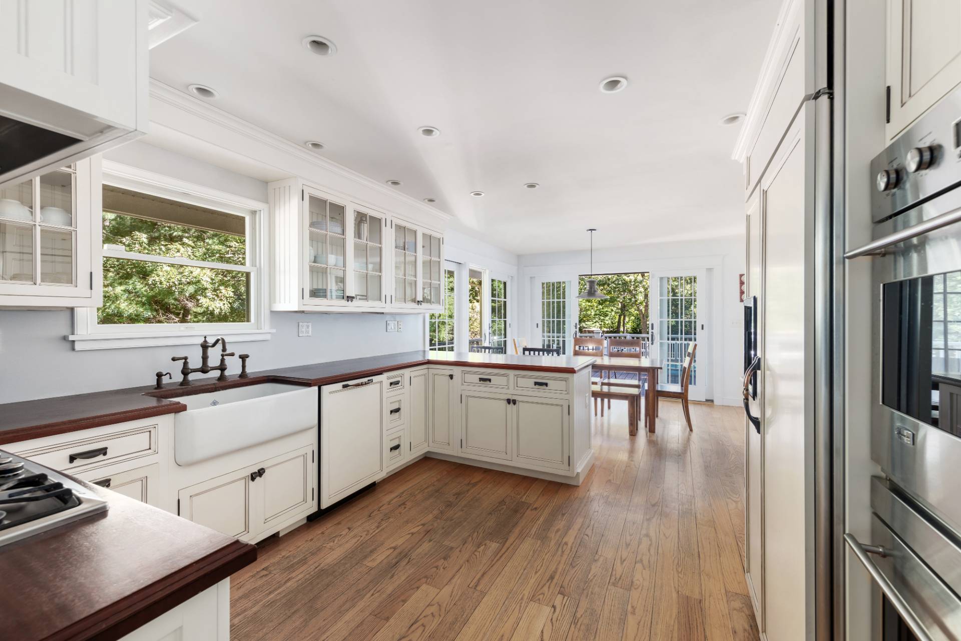 27 Ocean Parkway East Hampton, NY 11937 - Photo 6 of 21 a kitchen with sink cabinets and wooden floor