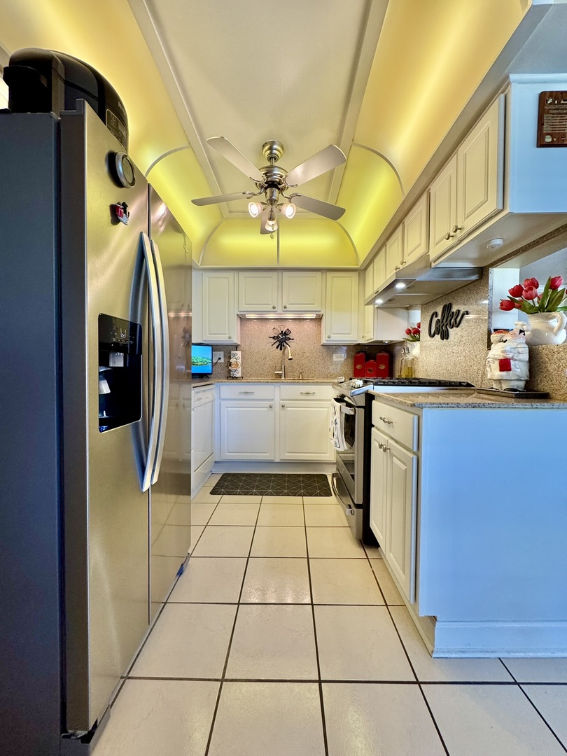 1247 South Mannheim Road, Unit 3 Westchester, IL 60154 - Photo 11 of 41 a kitchen with stainless steel appliances granite countertop a sink and cabinets