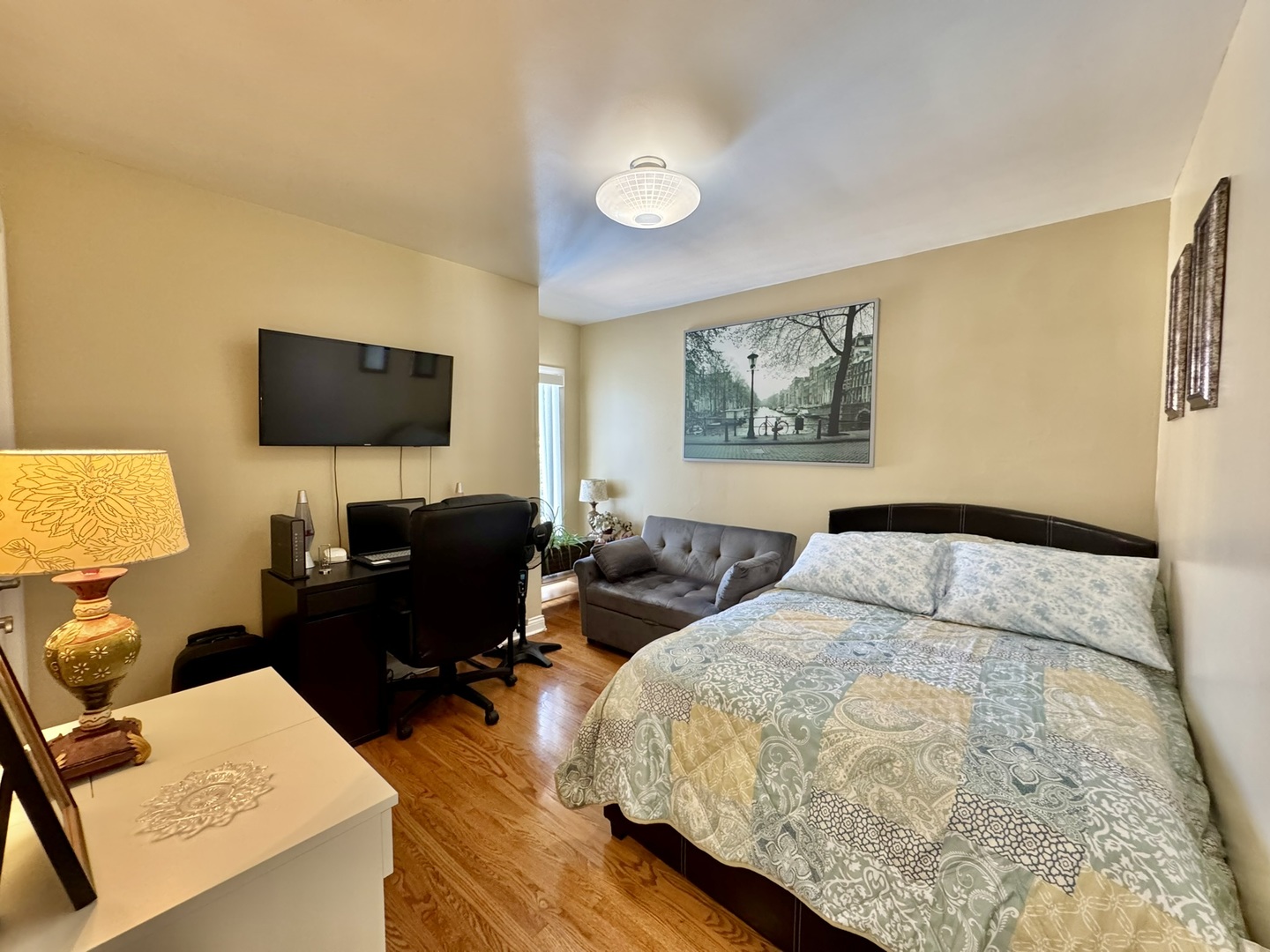 1247 South Mannheim Road, Unit 3 Westchester, IL 60154 - Photo 21 of 41 a bedroom with a bed and couch