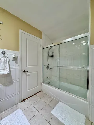 a bathroom with a shower and a sink