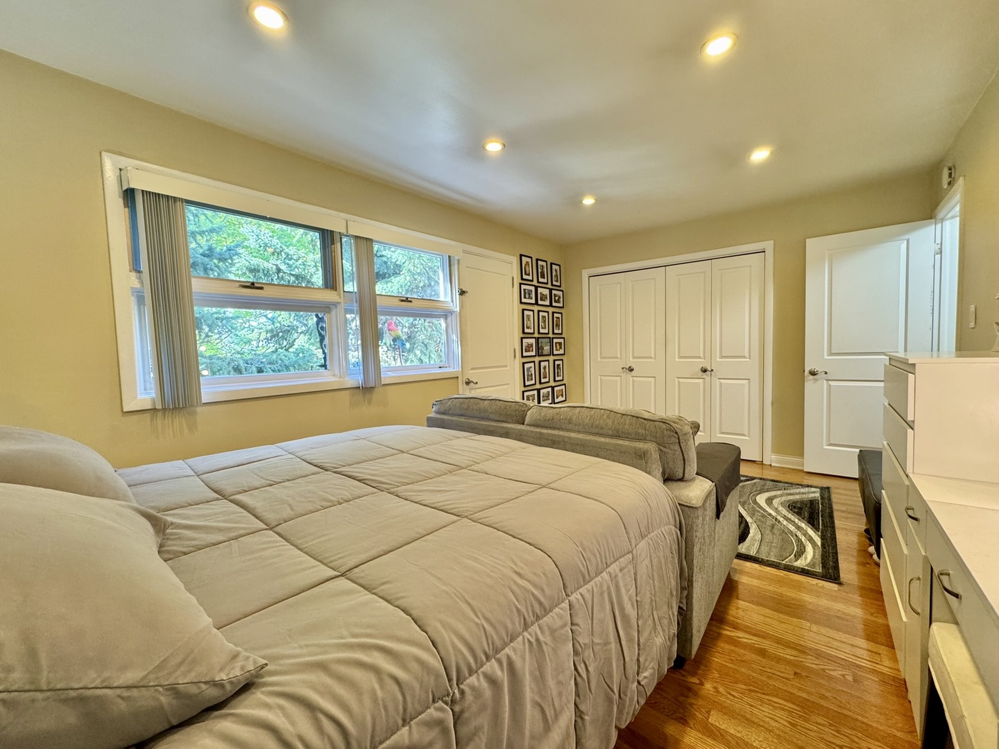 1247 South Mannheim Road, Unit 3 Westchester, IL 60154 - Photo 27 of 41 a spacious bedroom with a bed and a large window