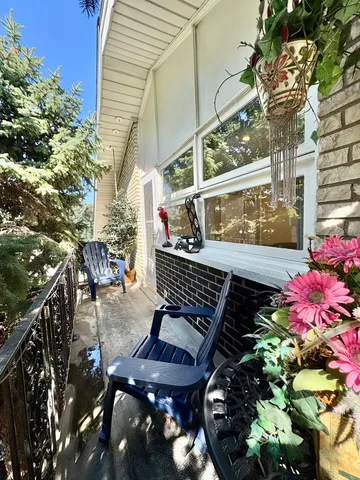 a view of a balcony with chairs