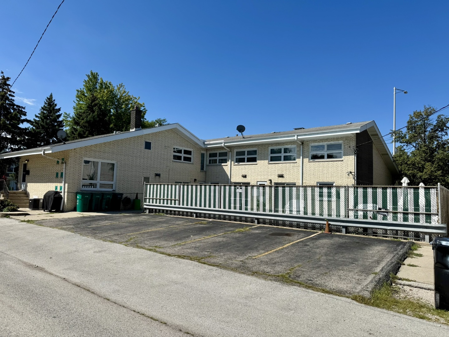 1247 South Mannheim Road, Unit 3 Westchester, IL 60154 - Photo 37 of 41 a view of a house with a wooden fence