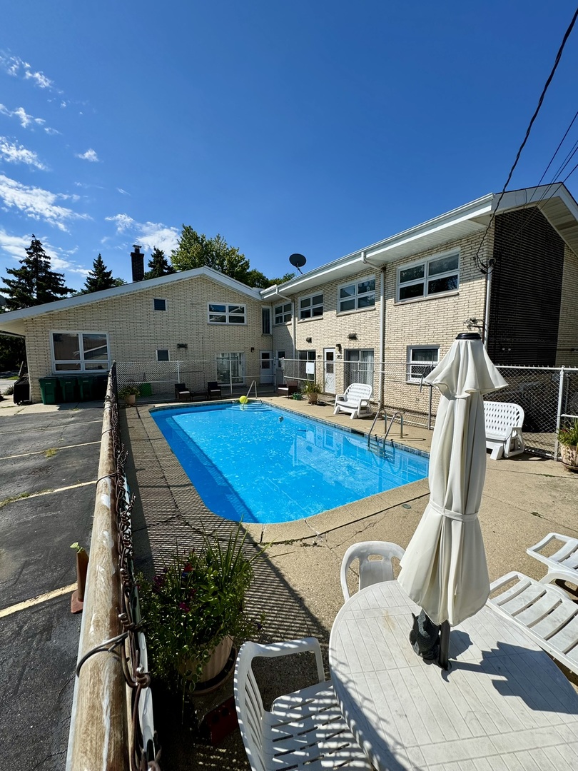 1247 South Mannheim Road, Unit 3 Westchester, IL 60154 - Photo 38 of 41 a view of a swimming pool with a patio