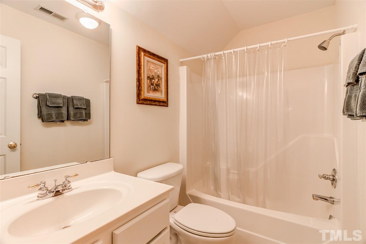 11604 John Allen Road Raleigh, NC 27614 - Photo 20 of 25 a bathroom with a sink a toilet and shower curtain