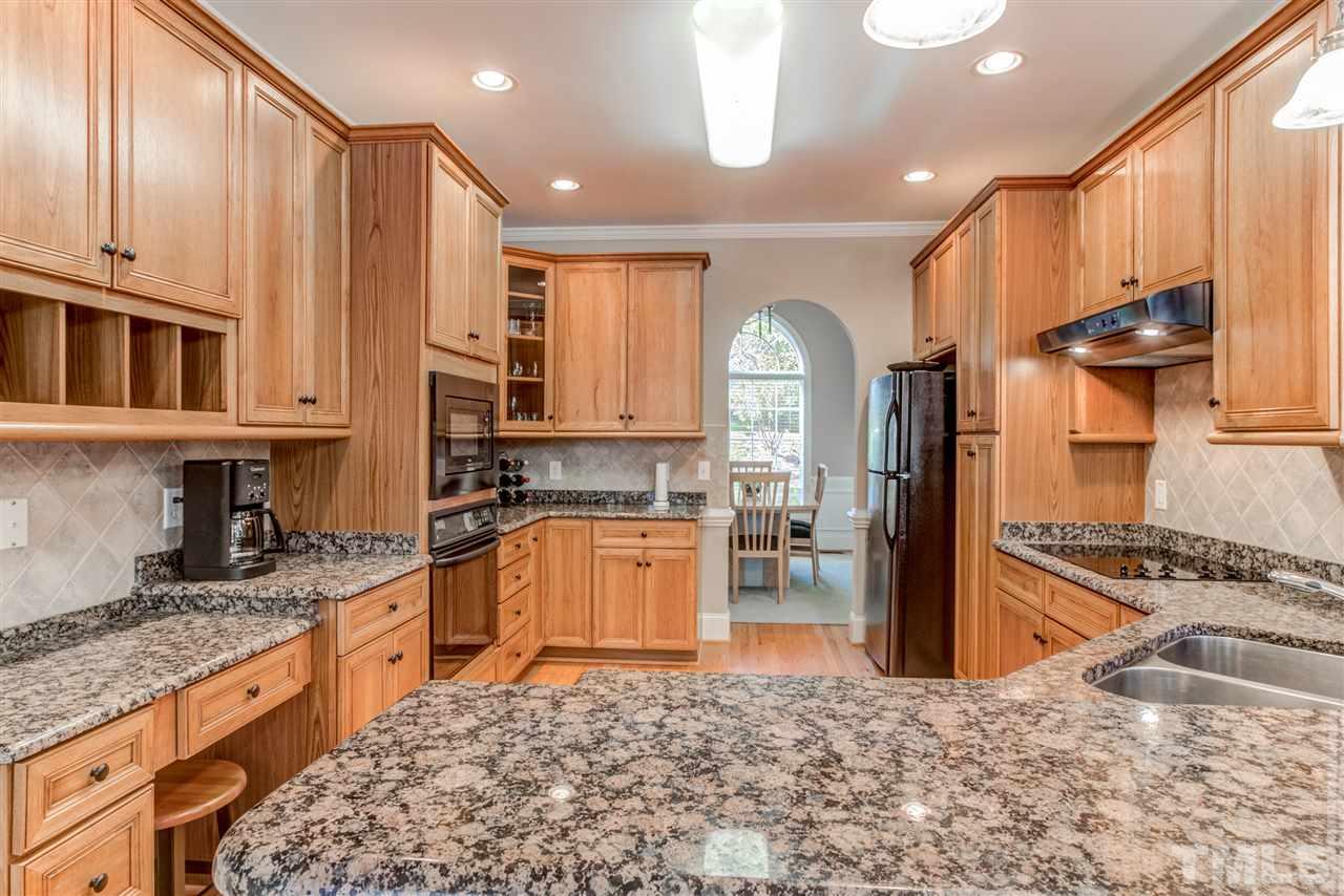 11604 John Allen Road Raleigh, NC 27614 - Photo 5 of 25 a kitchen with stainless steel appliances granite countertop a stove a sink and a microwave