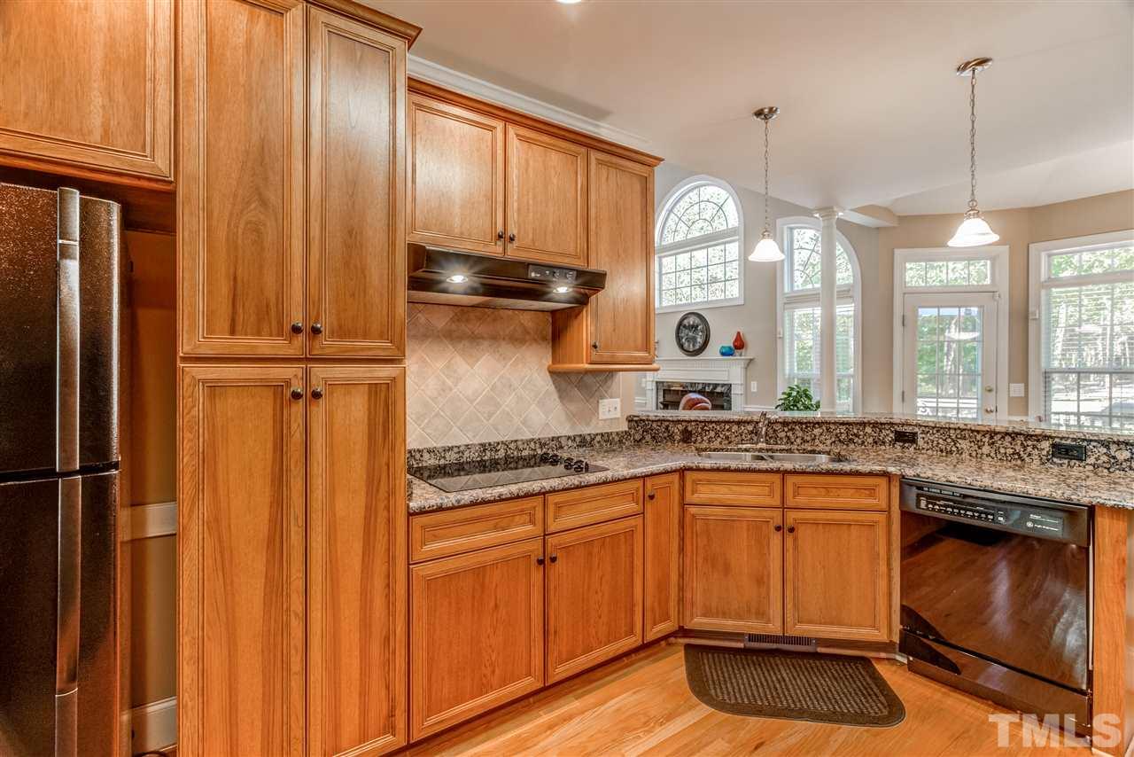11604 John Allen Road Raleigh, NC 27614 - Photo 7 of 25 a kitchen with a sink cabinets and window