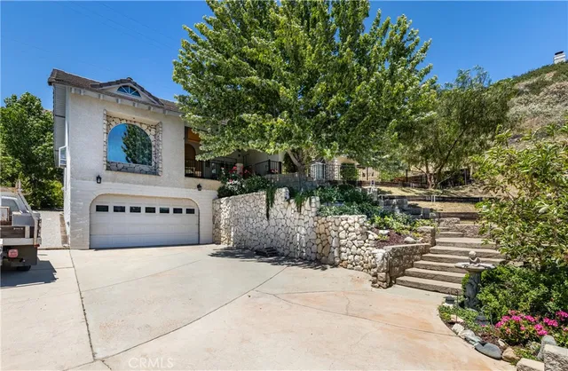 a sign board with buildings in the background