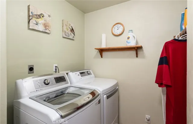 a bedroom with a large bed and a large window