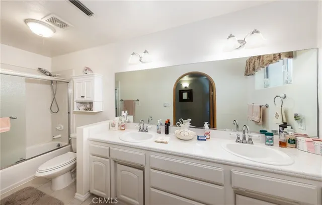 a view of a livingroom with furniture and a large window
