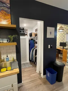 a view of a living room with a washer and dryer