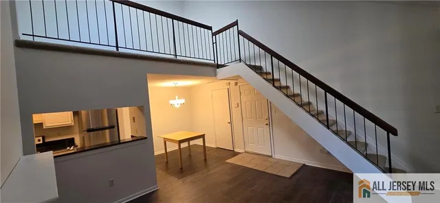 a view of staircase with wooden floor and stairs