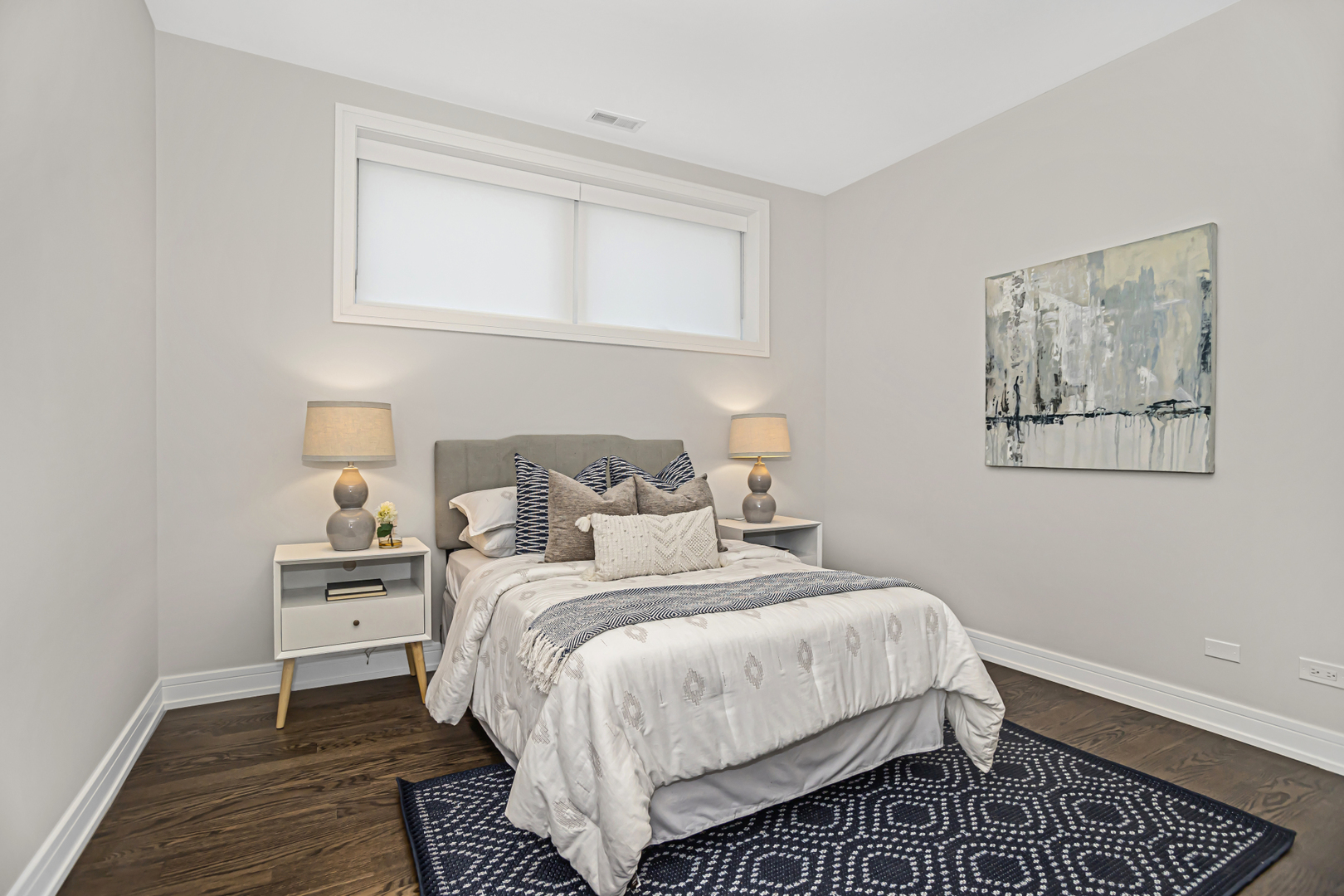 715 South May Street, Unit 1N Chicago, IL 60607 - Photo 17 of 25 a bedroom with a bed and wooden floor