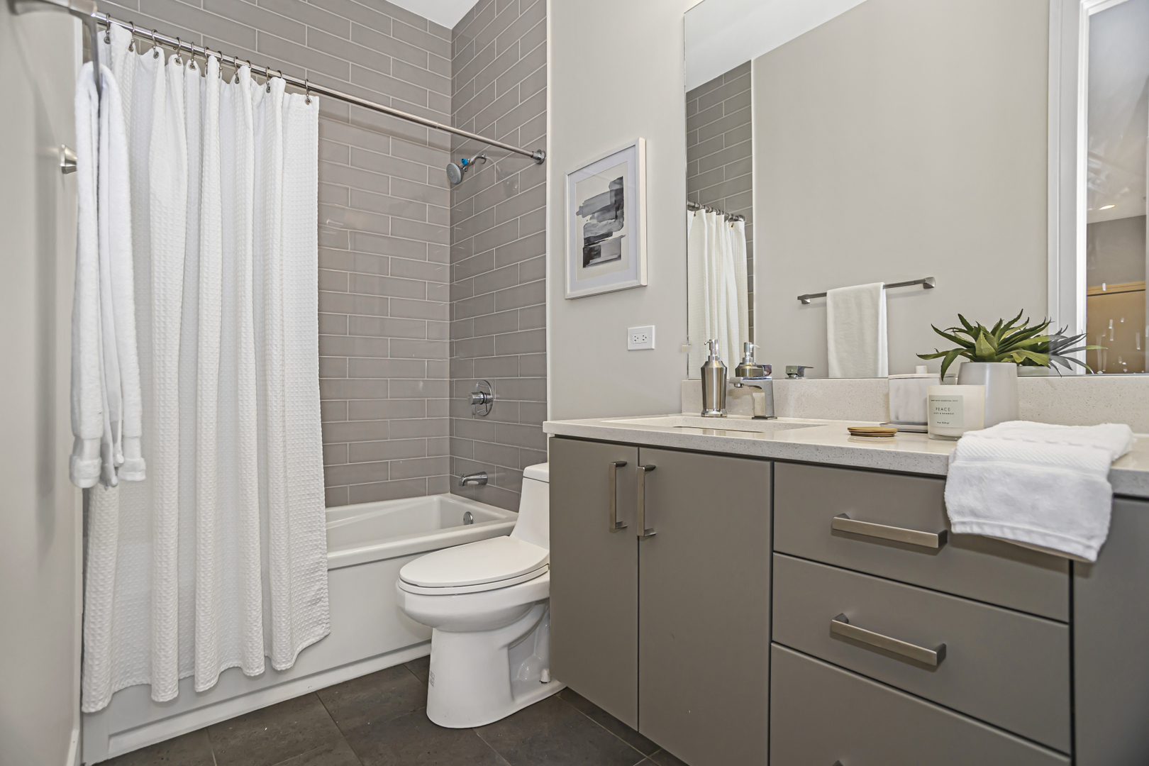 715 South May Street, Unit 1N Chicago, IL 60607 - Photo 19 of 25 a bathroom with a sink a toilet and shower